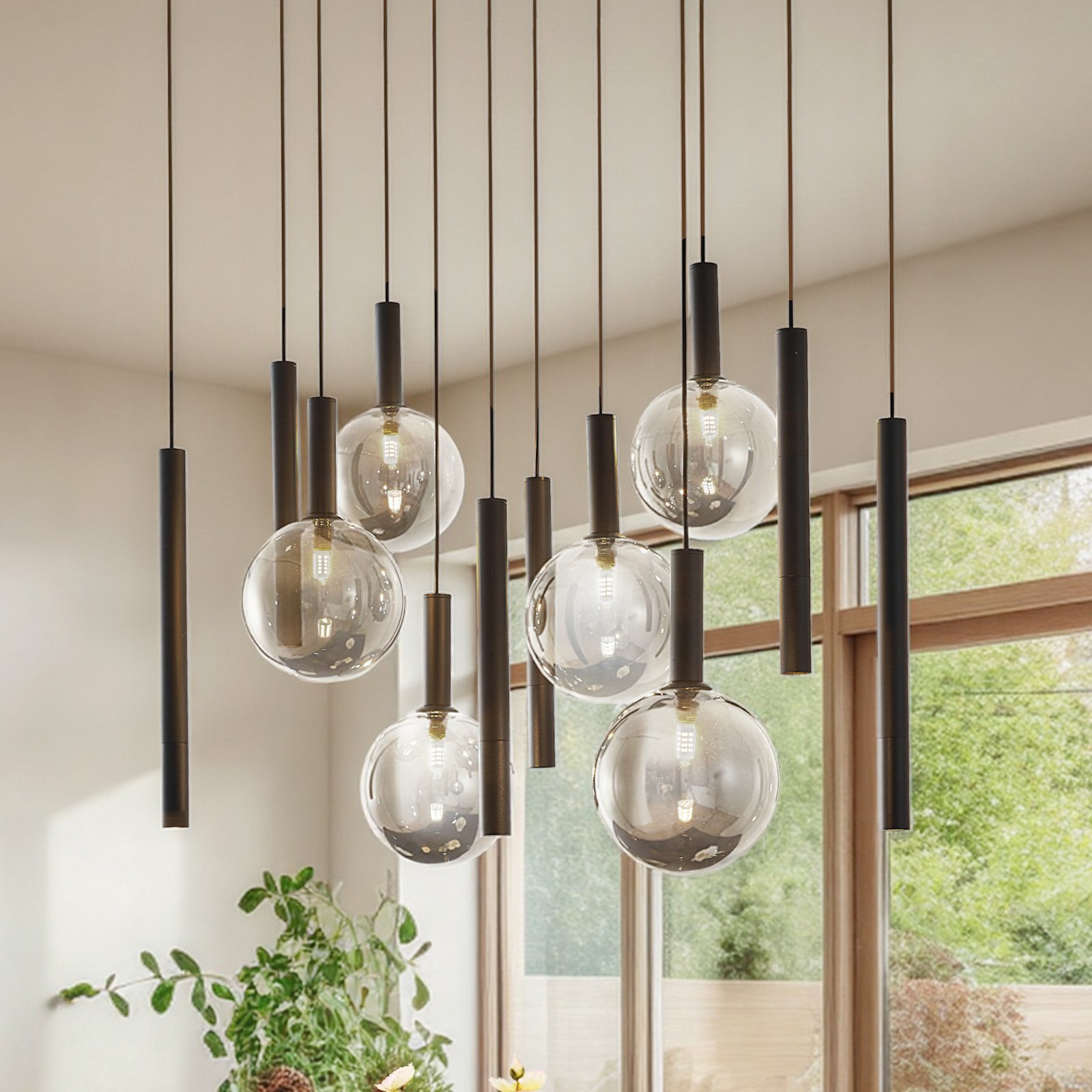 Lucande suspension Lumavia, à 12 lampes, verre, noir/transparent, G9